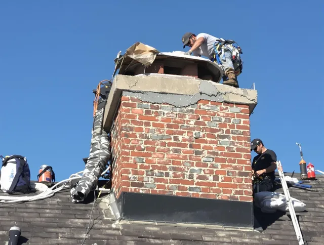 Wilmington Chimney Sweep installing a custom chimney crown in Wilmington, MA