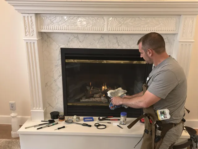 Wilmington Chimney Sweep performing fireplace maintenance in Wilmington, MA